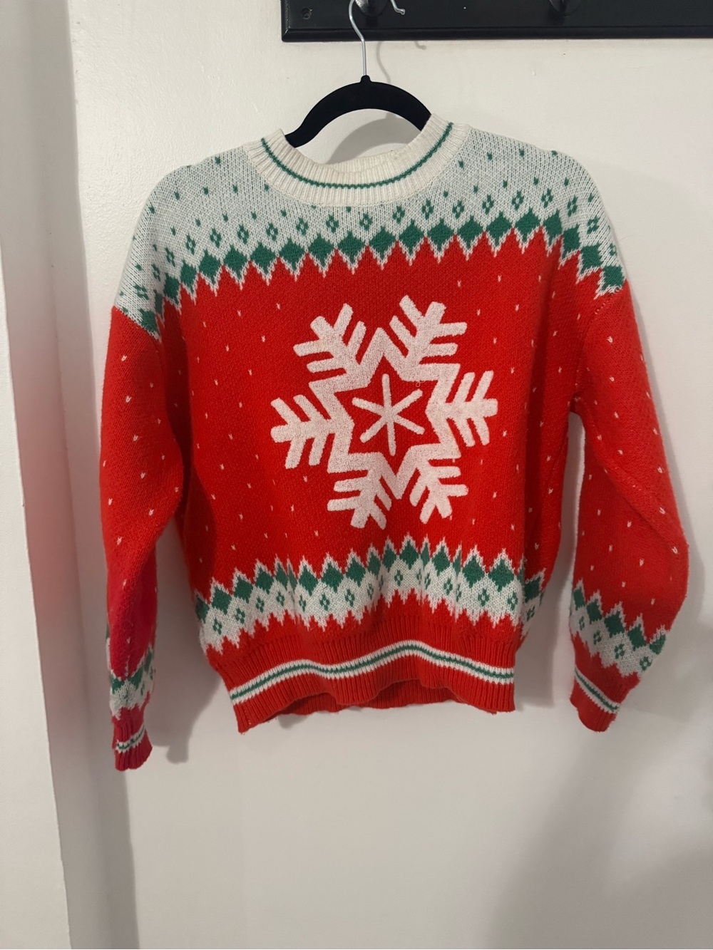 Festive Red and White Snowflake Crewneck Sweater with Green Accents